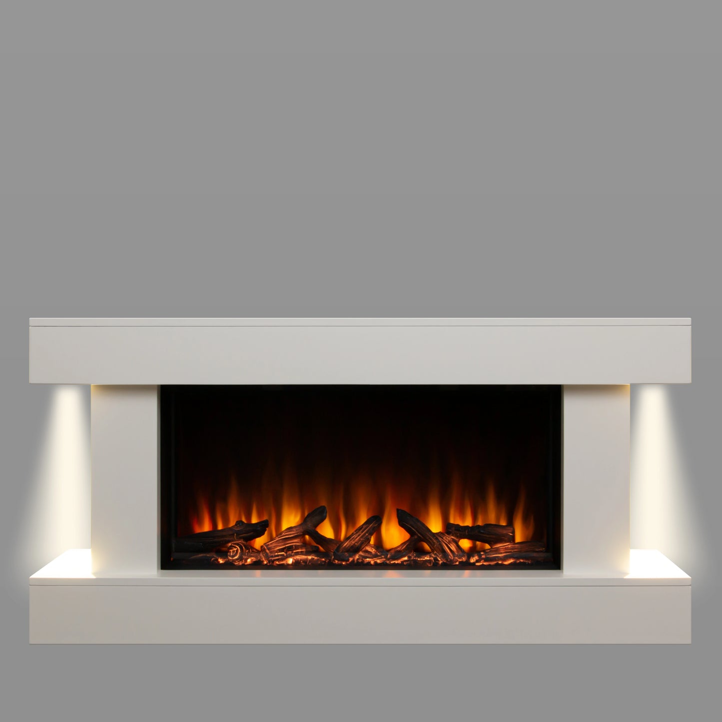 Modern electric fireplace with white surround and glowing logs on a gray background, and ambient lighting on both sides.