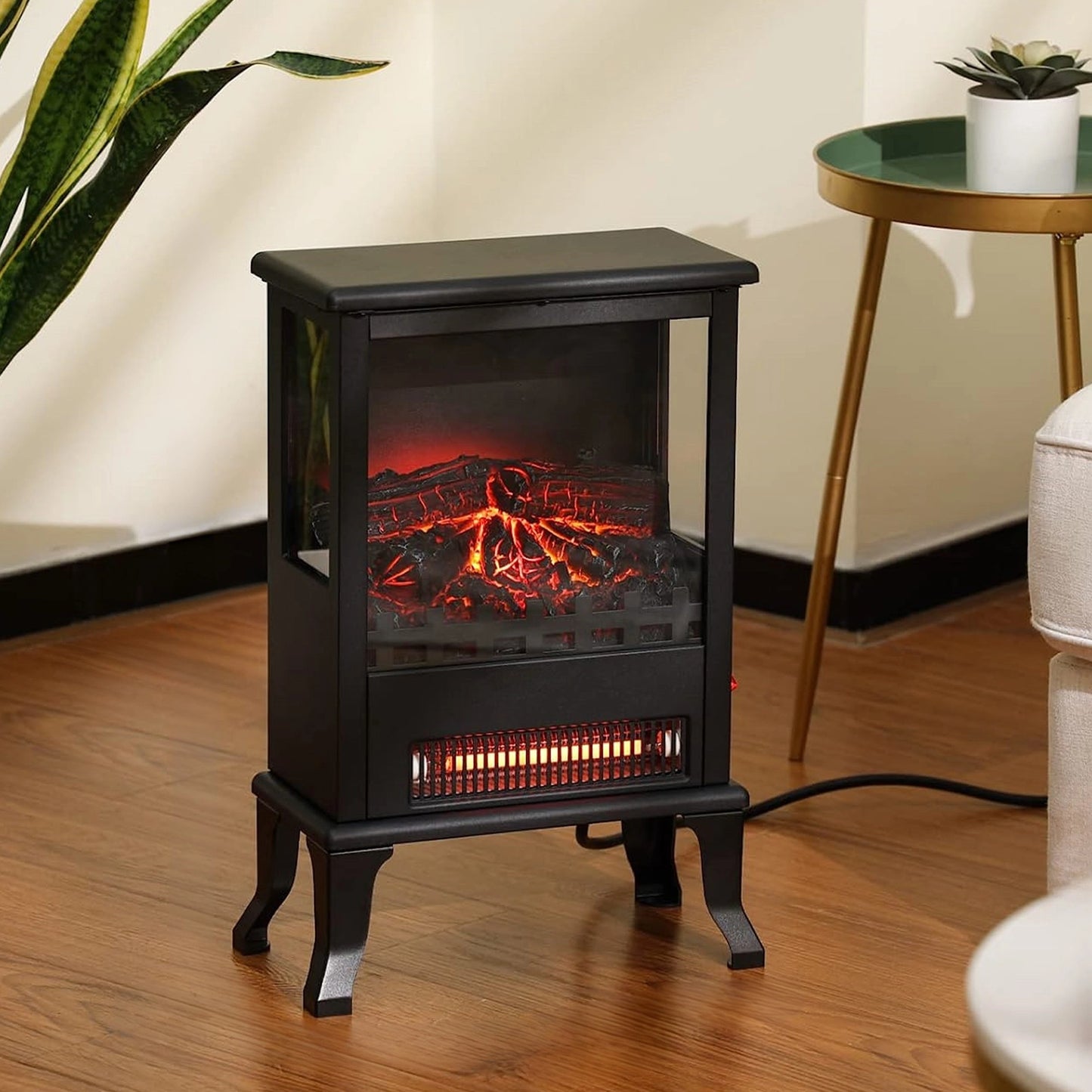 Black electric stove with flame effect on a wooden floor, surrounded by decor elements.
