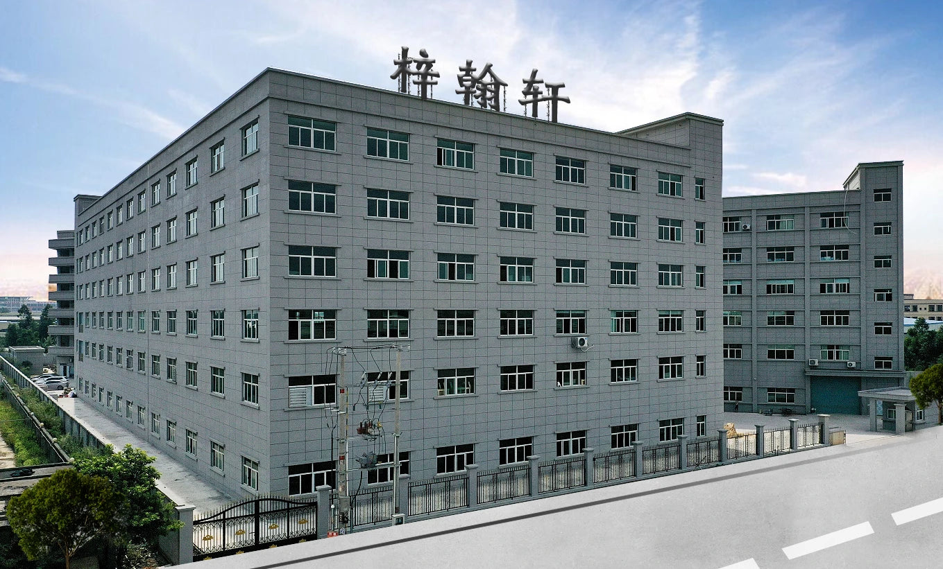 Modern factory building of Zihan Fireplace located in Huizhou, China, showcasing manufacturing scale and reliability.