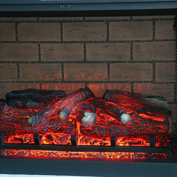 Electric fireplace with glowing logs and brick back panel
