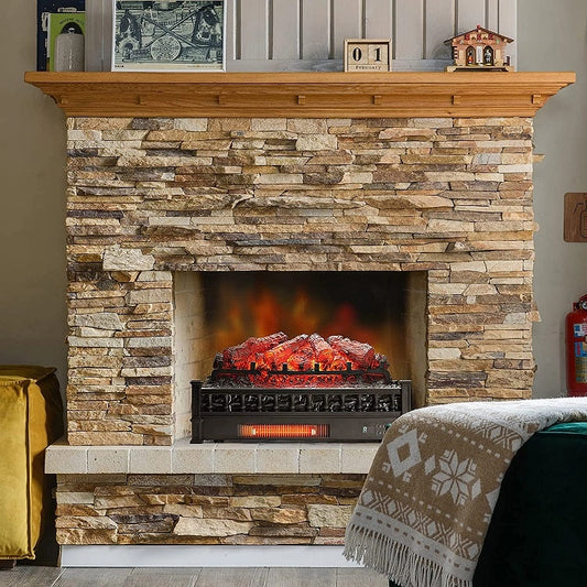 Stone fireplace with electric firelogs, mantel with decor items, and patterned blanket.
