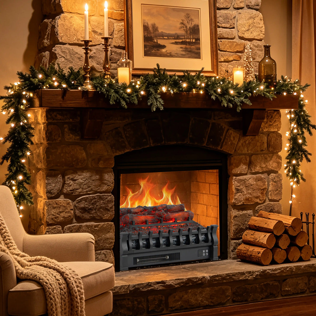A electric fireplace insert with realistic flames and glowing embers, set within a rustic stone fireplace. The fireplace is decorated with a green pine garland with warm white string lights, candles, and a framed picture on the mantel, with a stack of logs on the hearth and a cozy armchair in the foreground.