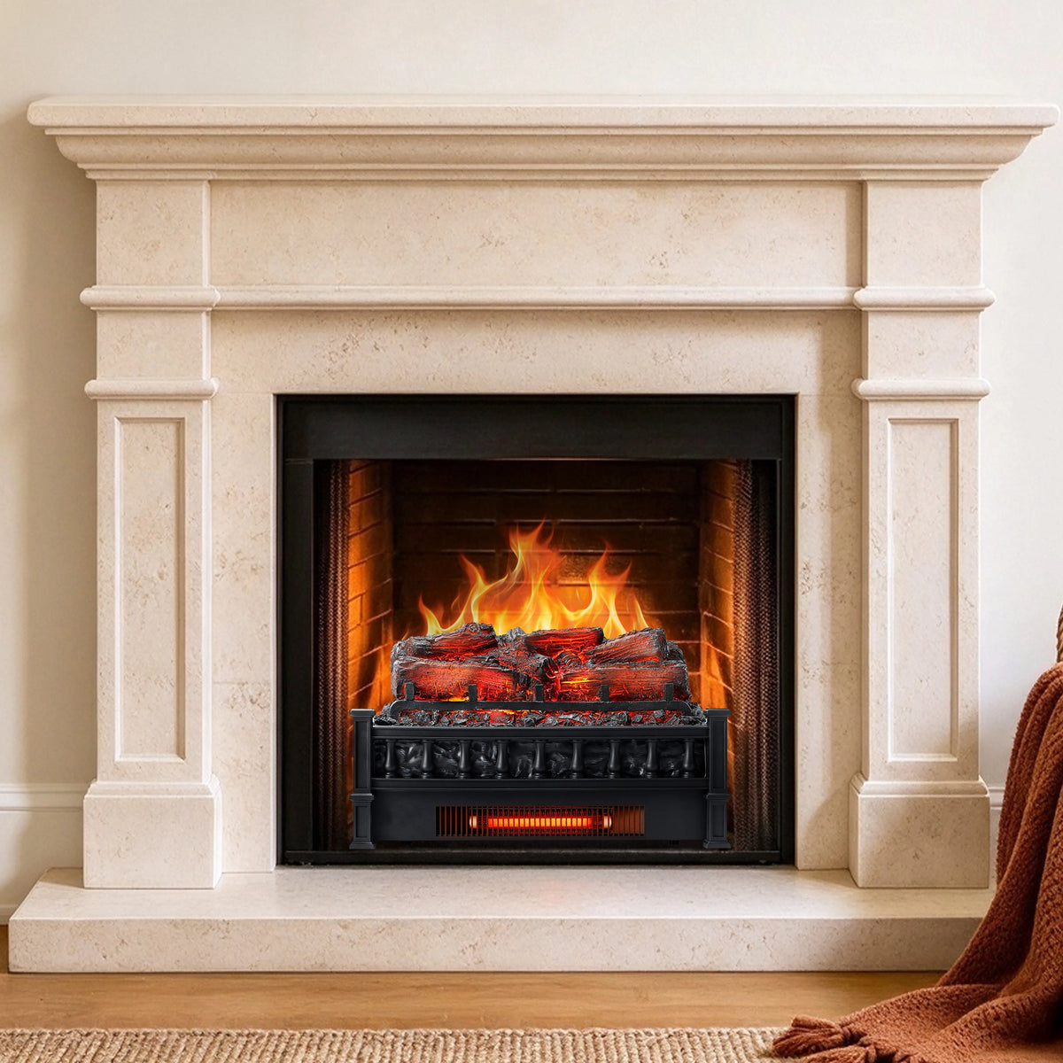 A modern electric fireplace insert set within a cream-colored stone mantel and hearth, featuring realistic orange and yellow flames and glowing embers over black faux logs.